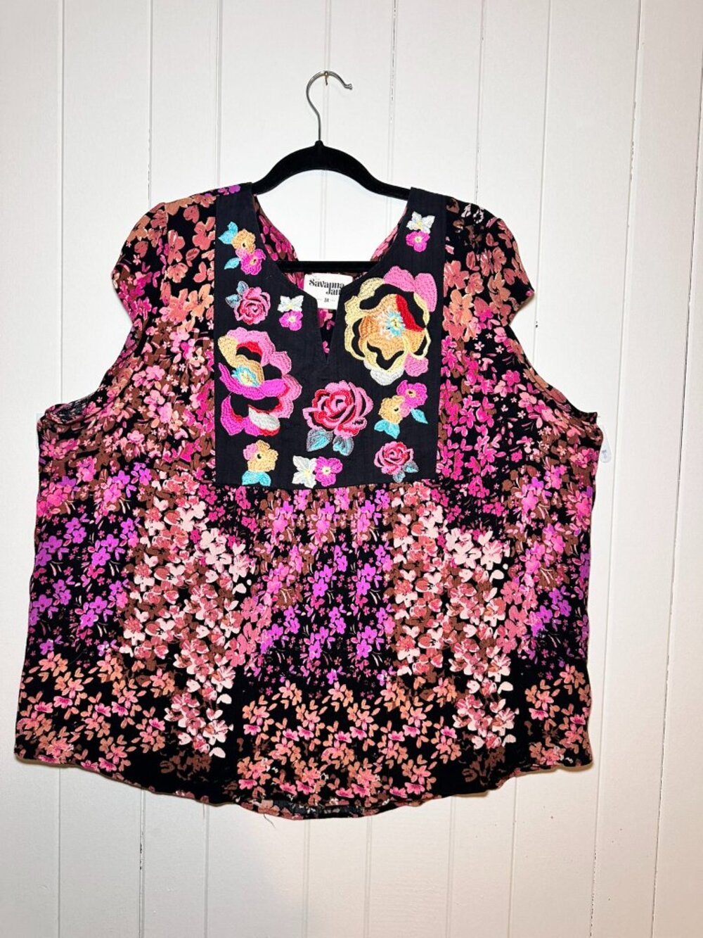 Savanna Jane, vibrant floral print & prominent colorful embroidery on the black